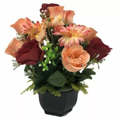Coupe de fleurs artificielles rouge et saumon dans un pot lestée pour cimetière