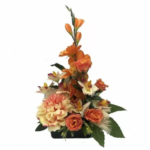 Jardinière de fleurs artificielles orange et saumon dans un pot lestée pour cimetière