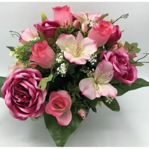 Coupe de fleurs artificielles rose dans un pot lestée pour cimetière